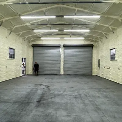 Finished spray foam insulated commercial shop with overhead lighting
